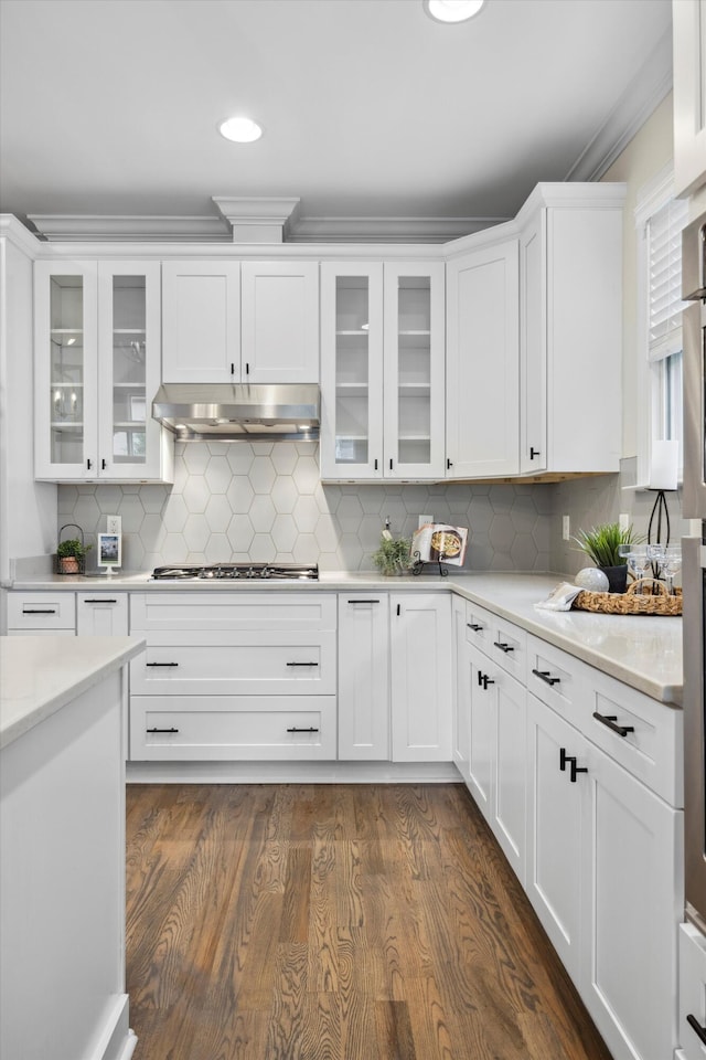 773 Curve St, Chattanooga, TN 37405 - kitchen with under cabinet range hood, light countertops, white cabinets, stainless steel gas cooktop, and ornamental molding