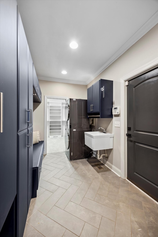 773 Curve St, Chattanooga, TN 37405 - laundry area featuring stacked washer / dryer, crown molding, recessed lighting, and light tile patterned flooring