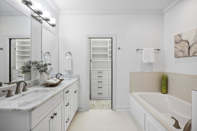 773 Curve St, Chattanooga, TN 37405 - bathroom featuring ornamental molding, double vanity, a garden tub, a spacious closet, and tile patterned floors