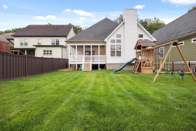 773 Curve St, Chattanooga, TN 37405 - rear view of house with a playground, a fenced backyard, a chimney, and a shingled roof