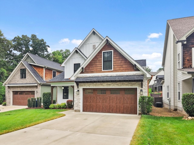 773 Curve St, Chattanooga, TN 37405 - craftsman inspired home featuring board and batten siding, a garage, a front yard, concrete driveway, and stone siding