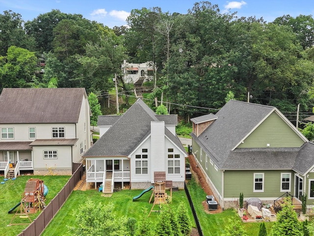 773 Curve St, Chattanooga, TN 37405 - back of house featuring a playground, roof with shingles, and a fenced backyard