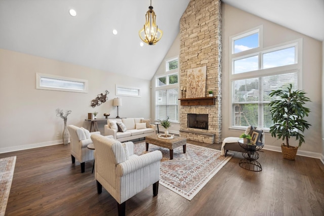 773 Curve St, Chattanooga, TN 37405 - living area with high vaulted ceiling, a stone fireplace, dark wood-style flooring, and a chandelier