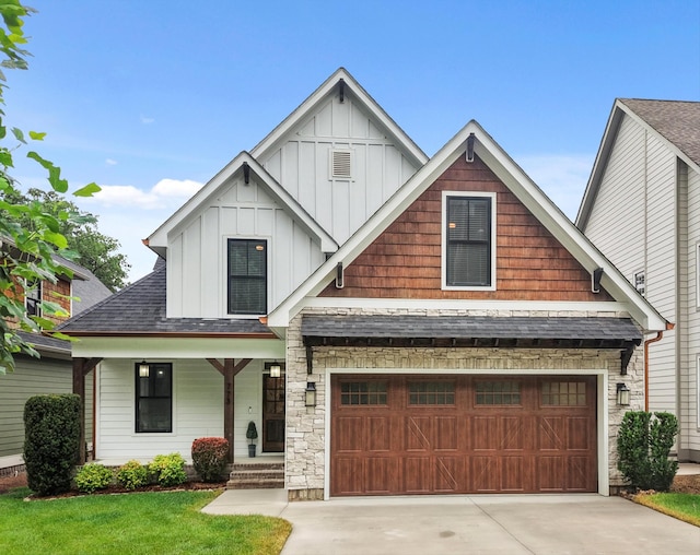 773 Curve St, Chattanooga, TN 37405 - craftsman-style house featuring board and batten siding, driveway, covered porch, and a garage