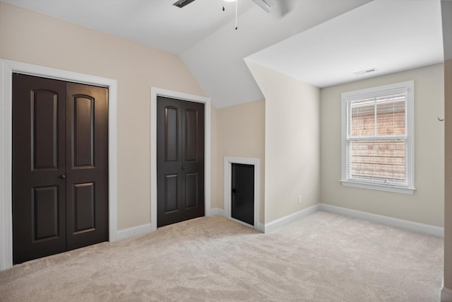 773 Curve St, Chattanooga, TN 37405 - unfurnished bedroom with multiple closets, carpet floors, vaulted ceiling, and ceiling fan