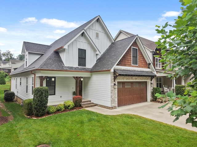 773 Curve St, Chattanooga, TN 37405 - view of front facade with an attached garage, board and batten siding, a front lawn, concrete driveway, and a shingled roof