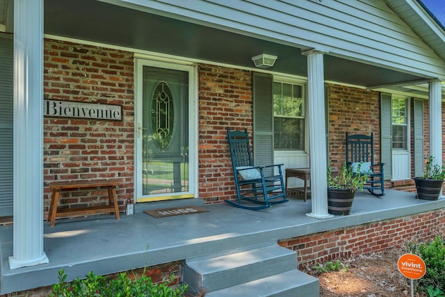 5058 New Chapel Rd, Springfield, TN 37172 - view of exterior entry with covered porch and brick siding