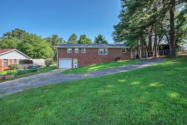 5058 New Chapel Rd, Springfield, TN 37172 - view of side of home featuring asphalt driveway, brick siding, and a garage