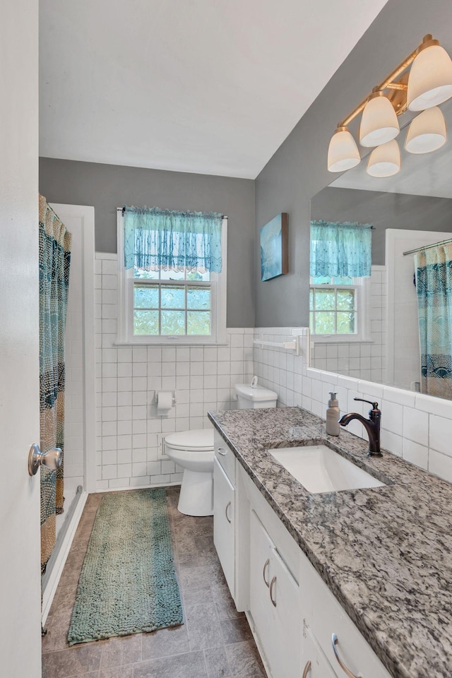 5058 New Chapel Rd, Springfield, TN 37172 - full bath with vanity, tile walls, a shower stall, and wainscoting