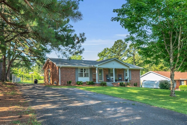 5058 New Chapel Rd, Springfield, TN 37172 - ranch-style home featuring a porch, brick siding, and driveway