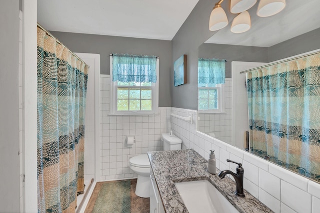 5058 New Chapel Rd, Springfield, TN 37172 - full bath with vanity, tile walls, curtained shower, wainscoting, and tile patterned flooring