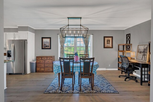 5058 New Chapel Rd, Springfield, TN 37172 - dining area featuring a chandelier, wood finished floors, a desk, and ornamental molding