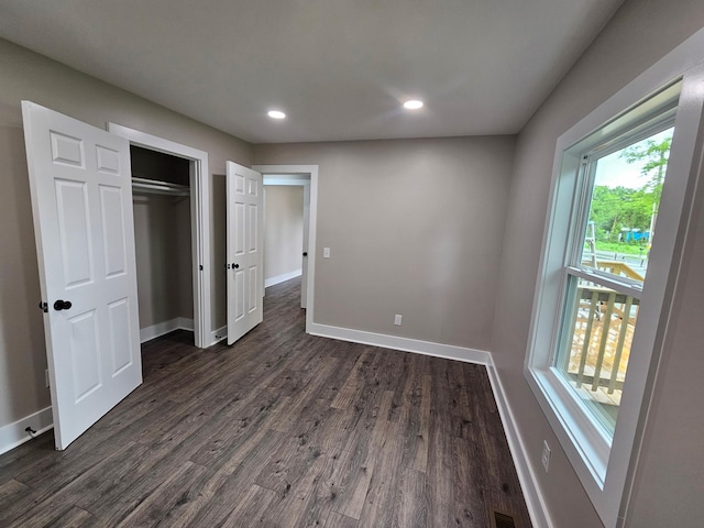 1204 W Lane St, Shelbyville, TN 37160 - unfurnished bedroom with dark wood-type flooring, recessed lighting, and a closet
