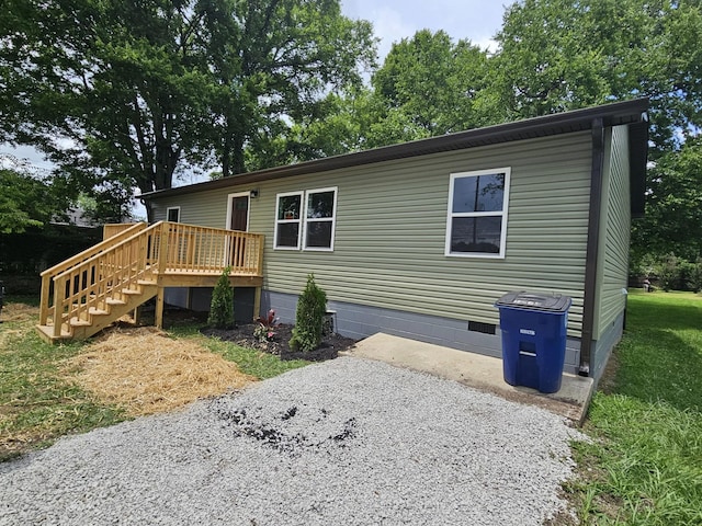 1204 W Lane St, Shelbyville, TN 37160 - view of front of property with crawl space, a deck, and stairs