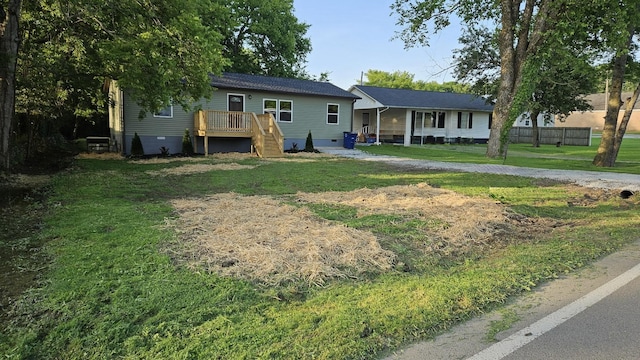 1204 W Lane St, Shelbyville, TN 37160 - ranch-style home with a front yard, a deck, and crawl space