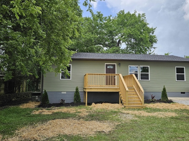 1204 W Lane St, Shelbyville, TN 37160 - view of front facade with crawl space, a front yard, a shingled roof, and a wooden deck
