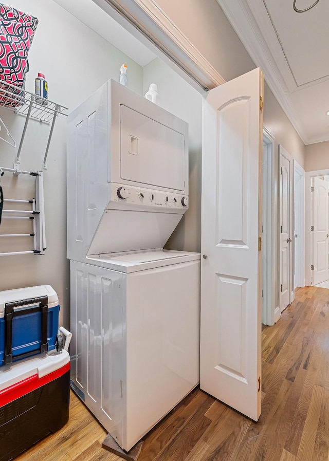 655 Lakeside Dr, Smithville, TN 37166 - washroom featuring stacked washer / dryer, light wood finished floors, and ornamental molding
