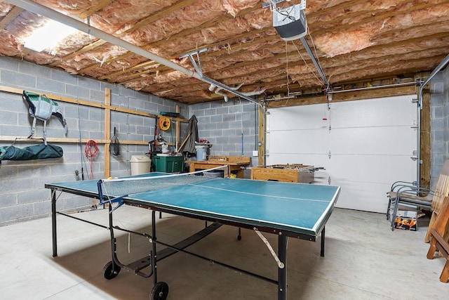 655 Lakeside Dr, Smithville, TN 37166 - rec room with concrete flooring, a garage, and concrete block wall