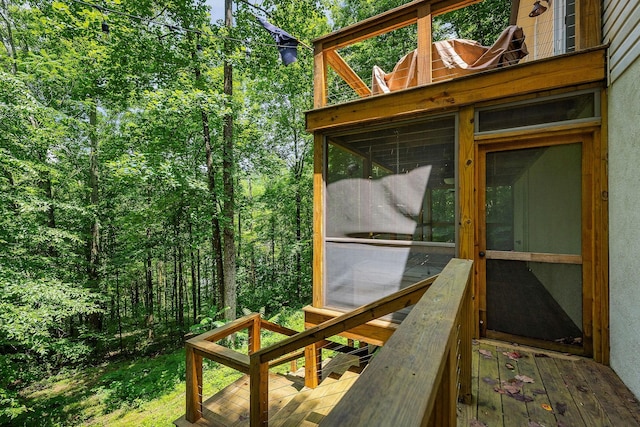 655 Lakeside Dr, Smithville, TN 37166 - wooden deck featuring a sunroom and a wooded view