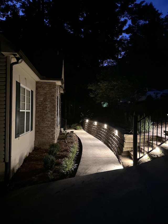 655 Lakeside Dr, Smithville, TN 37166 - view of side of property featuring stone siding and stucco siding