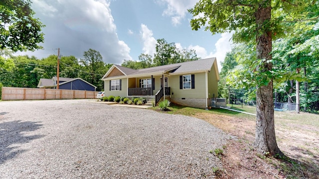 785 Grindstone Hollow Rd, Dickson, TN 37055 - view of front of home featuring crawl space, a porch, and gravel driveway
