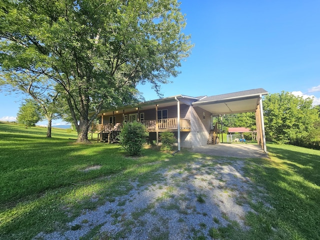 770 Jack Smith Rd, Dunlap, TN 37327 - view of grassy yard featuring driveway and a carport