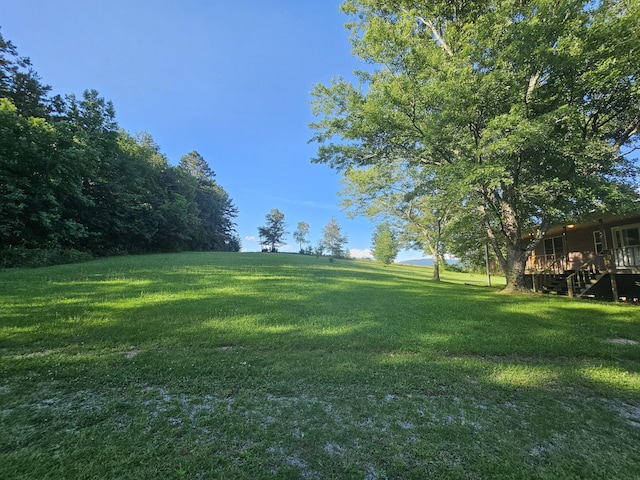 770 Jack Smith Rd, Dunlap, TN 37327 - view of grassy yard with stairway and a wooden deck