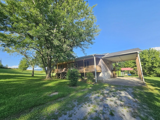 770 Jack Smith Rd, Dunlap, TN 37327 - view of green lawn featuring a carport, driveway, and stairs
