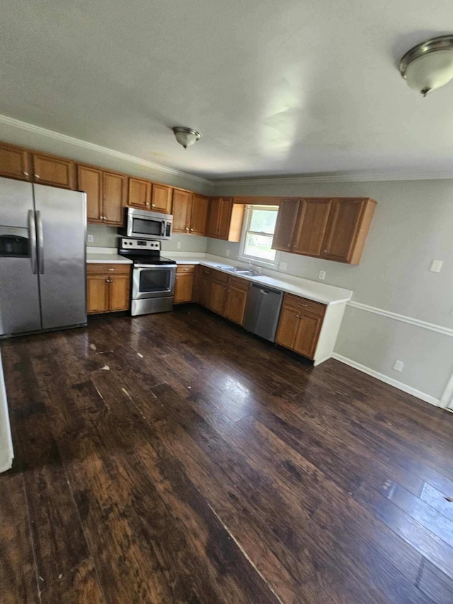 309 Byrd Ave, Murfreesboro, TN 37129 - kitchen with stainless steel appliances, dark wood-style flooring, light countertops, brown cabinets, and ornamental molding