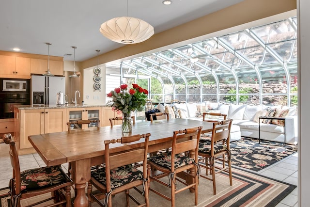 6607 Ormond Dr, Nashville, TN 37205 - tiled dining area featuring a sunroom and recessed lighting