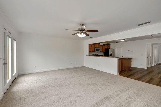 4247 Aurora Cir, Murfreesboro, TN 37127 - unfurnished living room with ceiling fan, dark colored carpet, and crown molding