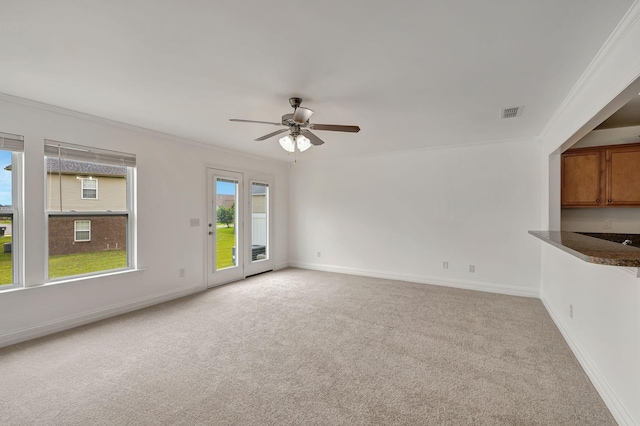 4247 Aurora Cir, Murfreesboro, TN 37127 - unfurnished living room featuring light colored carpet, ceiling fan, and crown molding