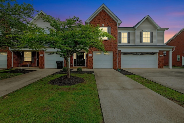 4247 Aurora Cir, Murfreesboro, TN 37127 - view of front facade with driveway, brick siding, and an attached garage