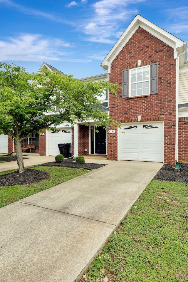 4247 Aurora Cir, Murfreesboro, TN 37127 - view of front of house with brick siding, driveway, and a garage