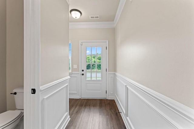 2529 Precast Dr, Columbia, TN 38401 - doorway featuring crown molding, dark wood finished floors, wainscoting, and a decorative wall