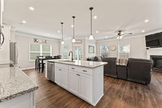 2529 Precast Dr, Columbia, TN 38401 - kitchen featuring appliances with stainless steel finishes, ceiling fan, white cabinetry, dark wood-style floors, and crown molding