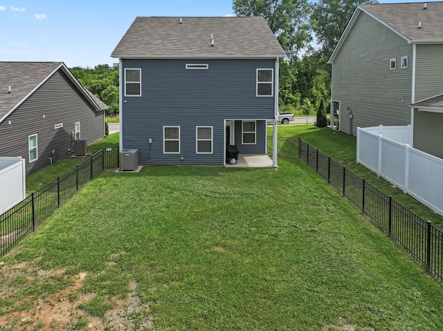 2529 Precast Dr, Columbia, TN 38401 - back of property with a patio area, a fenced backyard, and a shingled roof