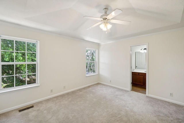 354 Arapaho Dr, Murfreesboro, TN 37128 - empty room with a tray ceiling, light colored carpet, a ceiling fan, and crown molding
