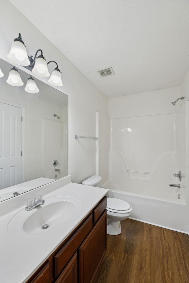 354 Arapaho Dr, Murfreesboro, TN 37128 - bathroom featuring vanity, wood finished floors, and shower / washtub combination
