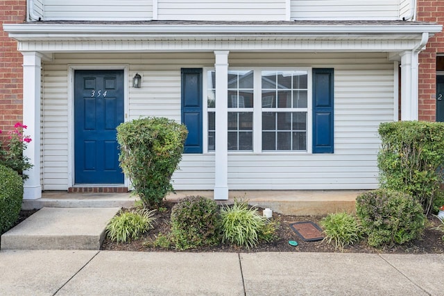 354 Arapaho Dr, Murfreesboro, TN 37128 - property entrance with brick siding and a porch