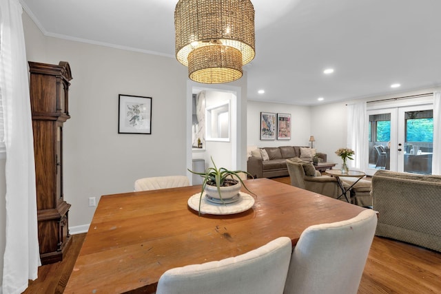 106 Dellrose Dr, Nashville, TN 37214 - dining area featuring french doors, wood finished floors, a chandelier, crown molding, and recessed lighting