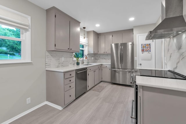 106 Dellrose Dr, Nashville, TN 37214 - kitchen featuring stainless steel appliances, wall chimney exhaust hood, backsplash, gray cabinets, and recessed lighting