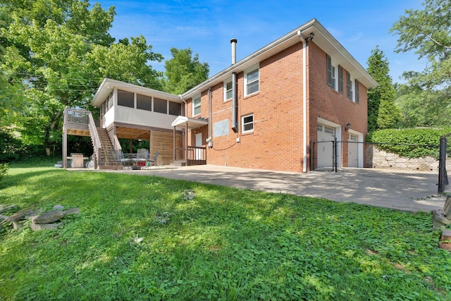 106 Dellrose Dr, Nashville, TN 37214 - rear view of property featuring a sunroom, brick siding, a gate, stairs, and a garage