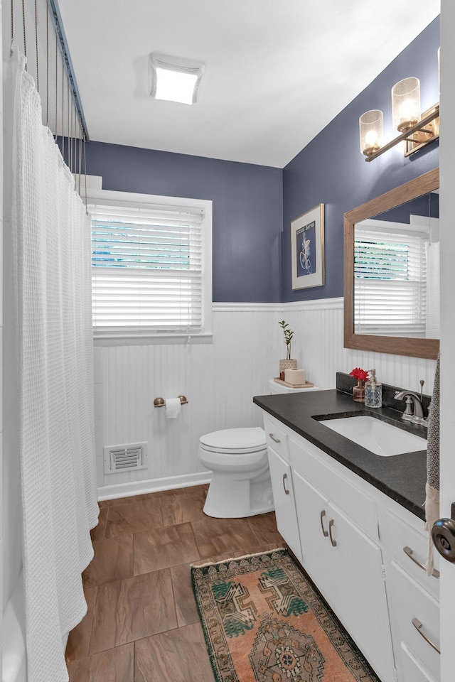 106 Dellrose Dr, Nashville, TN 37214 - full bathroom featuring vanity, a wainscoted wall, plenty of natural light, and a shower with shower curtain