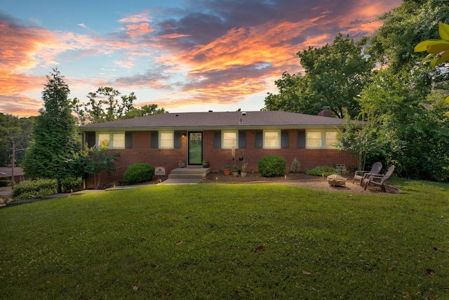 106 Dellrose Dr, Nashville, TN 37214 - ranch-style house featuring brick siding, a front yard, an outdoor fire pit, and a chimney