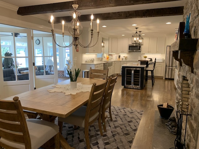 136 Houghton Dr, Winchester, TN 37398 - dining space with a chandelier, dark wood finished floors, recessed lighting, beam ceiling, and ornamental molding