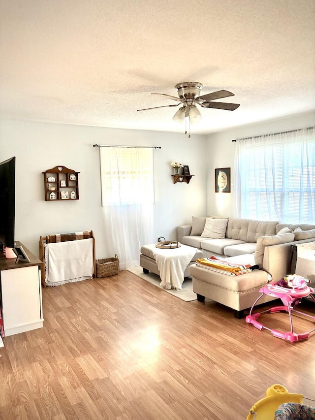 30429 Sims St, Ardmore, TN 38449 - living room with ceiling fan, light wood finished floors, and a textured ceiling