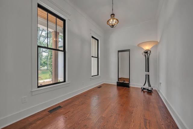 445 Old Pond Ln, Dickson, TN 37055 - spare room featuring dark wood-style flooring and a chandelier