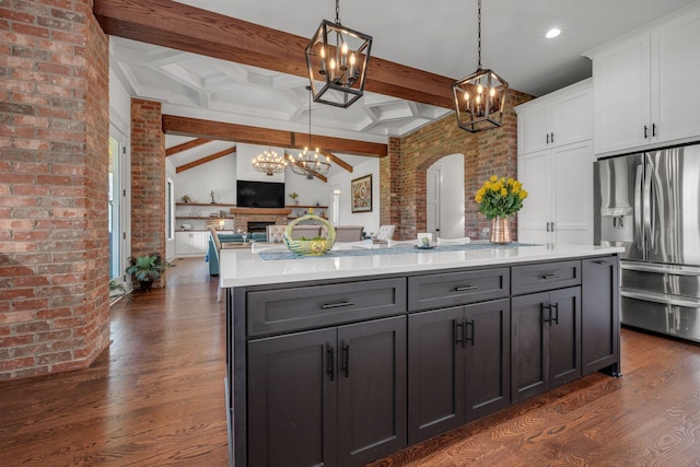 445 Old Pond Ln, Dickson, TN 37055 - kitchen with a chandelier, stainless steel fridge, dark wood-style flooring, open floor plan, and white cabinets