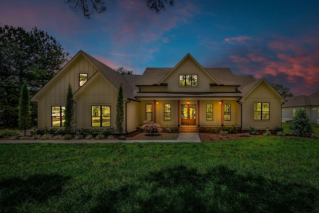 445 Old Pond Ln, Dickson, TN 37055 - back of house featuring covered porch, a lawn, board and batten siding, and roof with shingles